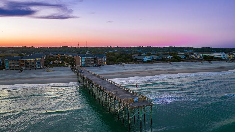 The Pawleys Island pier reaching into the Atlantic at dusk
